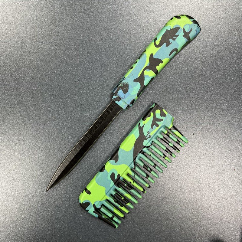 comb with knife in handle